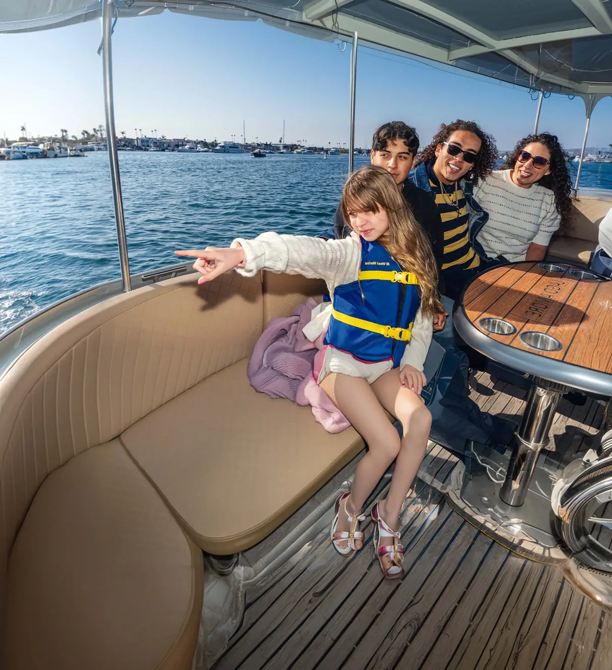 Family enjoying a boat ride in Newport Beach